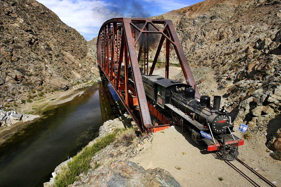 Steam engine locomotive at a bridge in the steppe, the Patagonian Express train