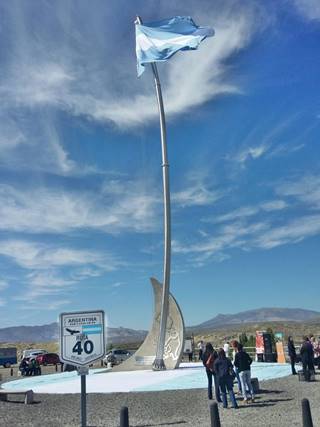 Ruta 40 midpoint monument with flag atop mast