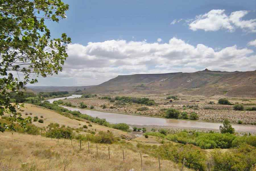 Colló Cura river, some trees in its valley and the arid highlands