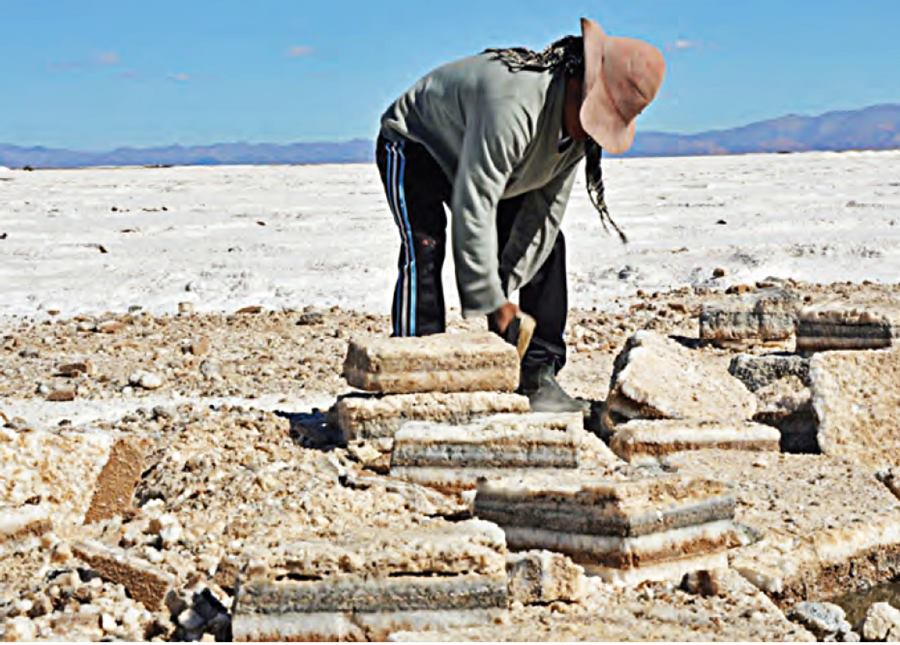 man cutting salt blocsk at Salinas Grandes